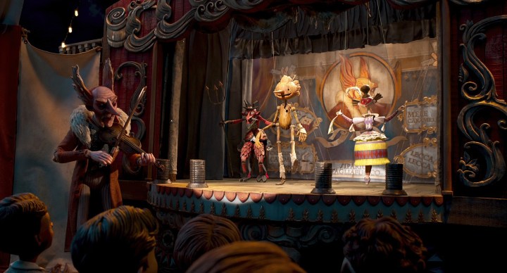 Cout Volpe plays music while Pinocchio dances on stage.