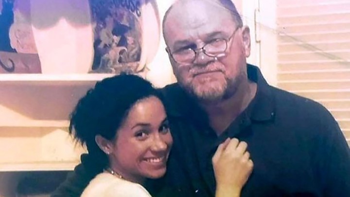 A throwback photo of a young Meghan Markle hugging her father Thomas.