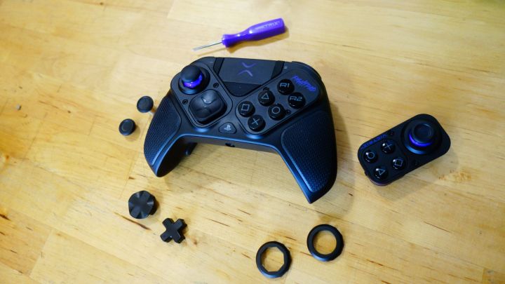 A Victrix Pro BFG and all its parts sit splayed out on a table.