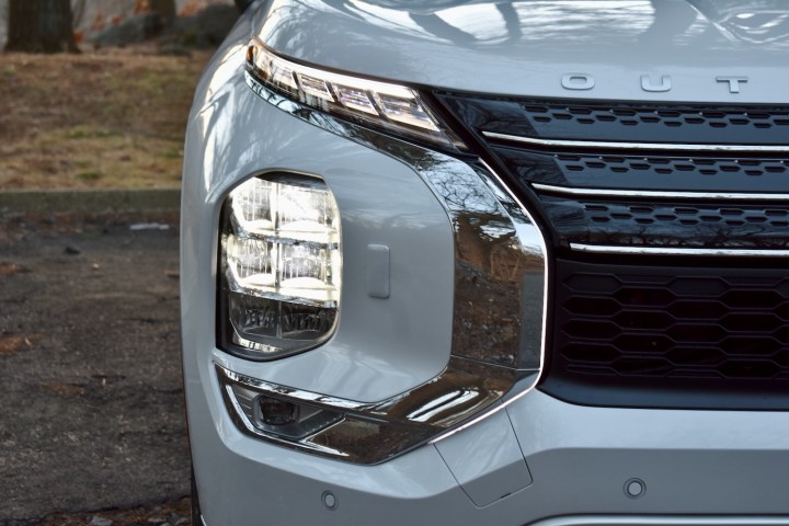 Close-up of the 2023 Mitsubishi Outlander PHEV's headlight.