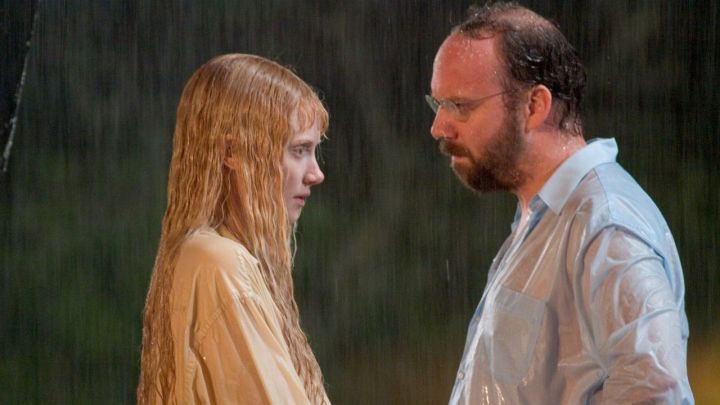 A young woman and a man standing under the rain in the movie Lady In The Water.