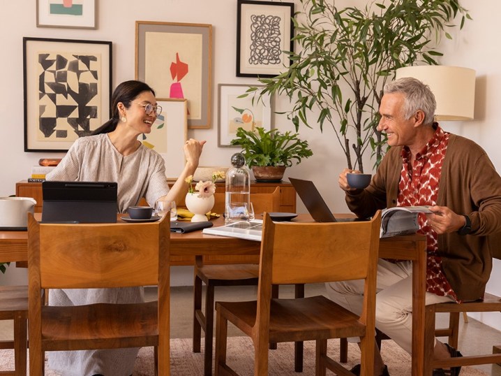 Family using internet in dining room