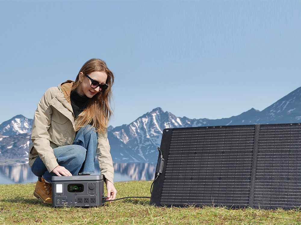 Growatt VITA 550 solar generator outdoors and charging.
