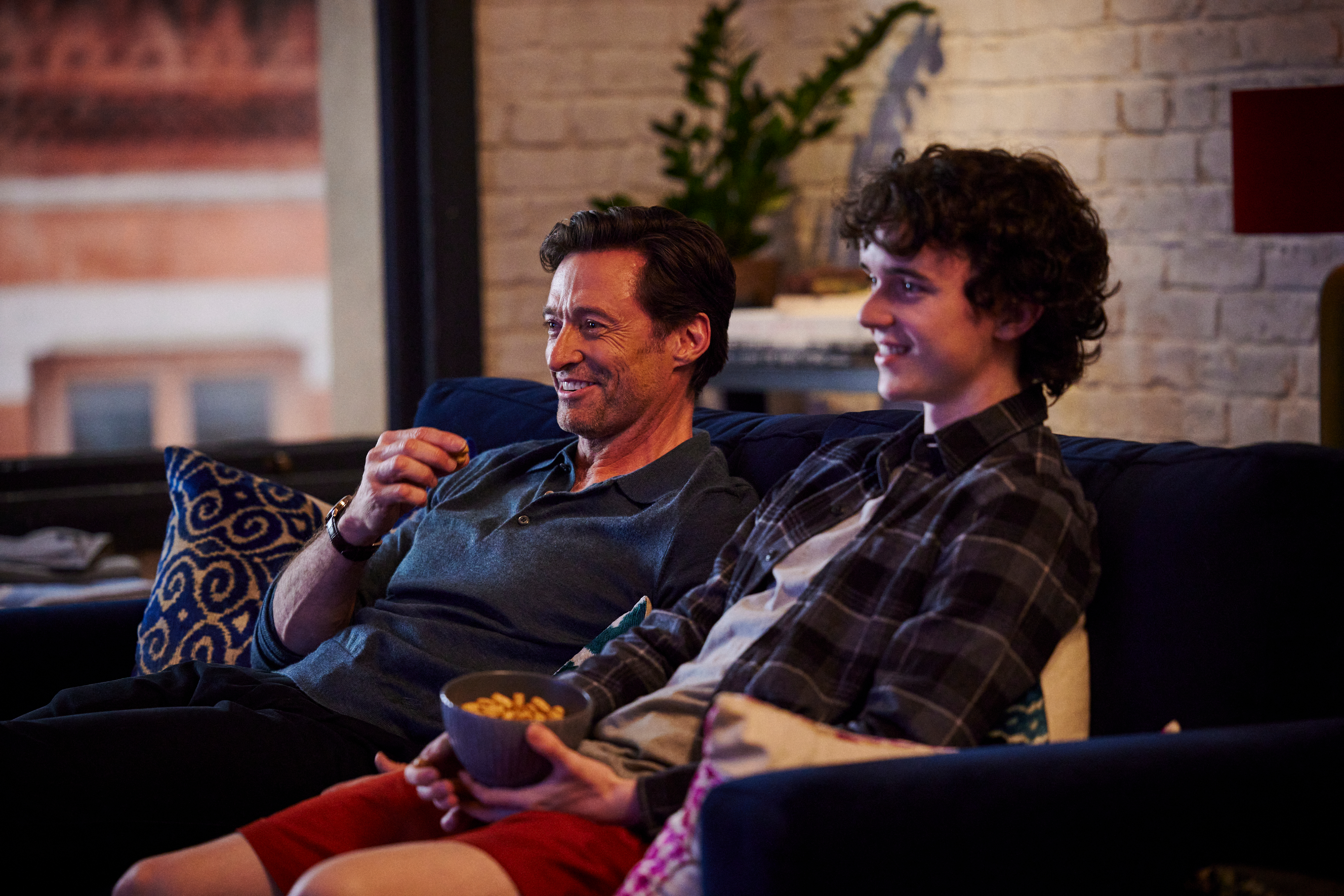 Hugh Jackman sits on a couch with Zen McGrath in The Son.