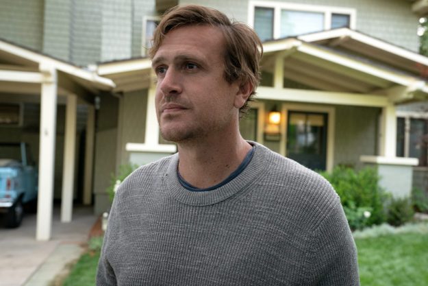 Jason Segel stands near a house in Shrinking.