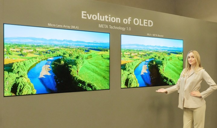 A spokesmodel stands by screens showing LG Display's META OLED technology at CES 2023.