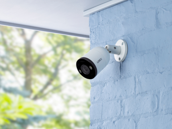 The Lorex outdoor IP security camera installed on a brick wall.