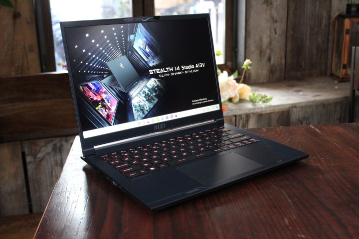 MSI's Stealth 16 Studio laptop sits on a table.