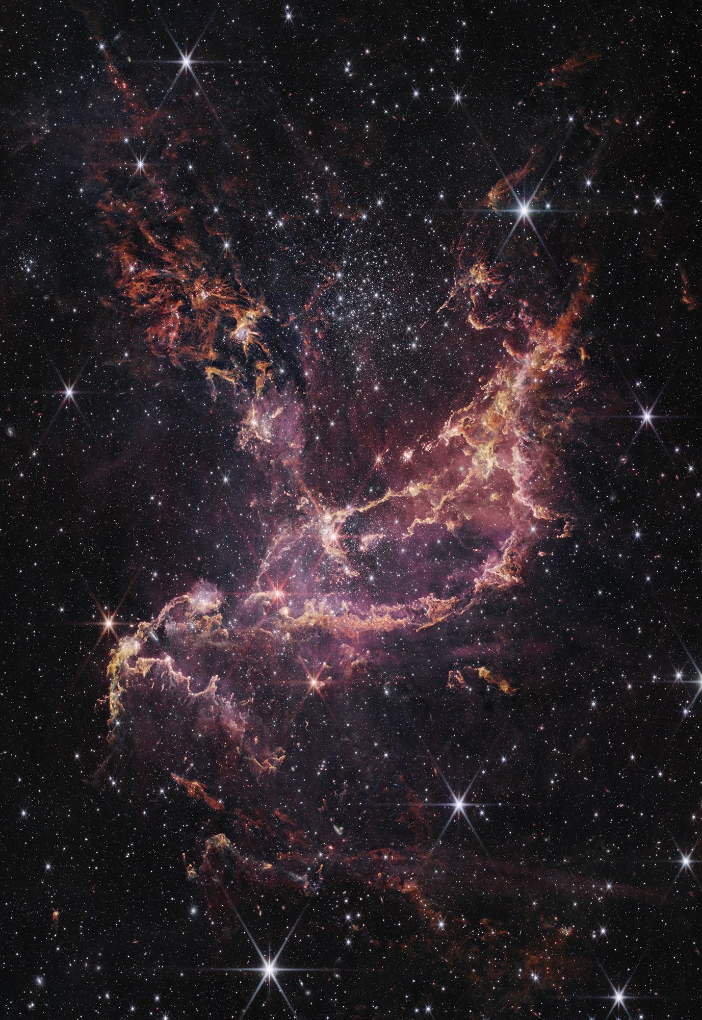नासा के जेम्स वेब स्पेस टेलीस्कॉप नियर-इन्फ्रारेड कैमरा (एनआईआरसीएएम) से इस छवि में यहां दिखाया गया एनजीसी 346, एक गतिशील स्टार क्लस्टर है जो 200,000 प्रकाश वर्ष दूर एक नेबुला के भीतर स्थित है।