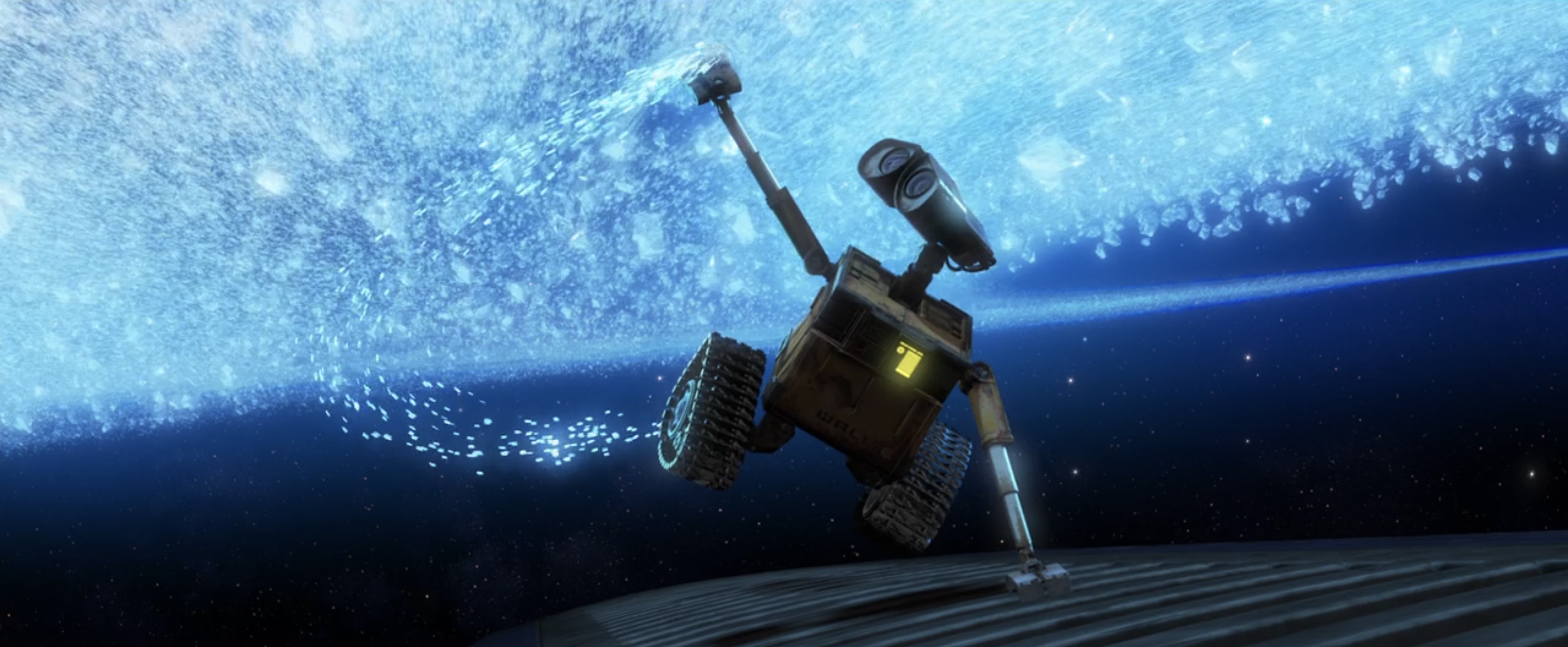 WALL-E reaching out to a ring system in "WALL-E."