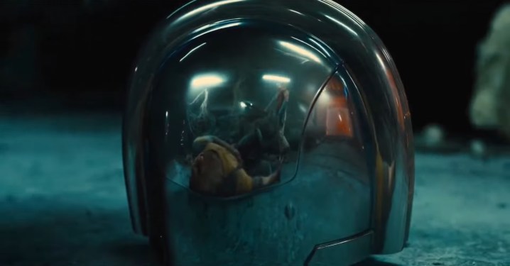 Rick and Chris reflected in Peacemaker's helmet in "The Suicide Squad."