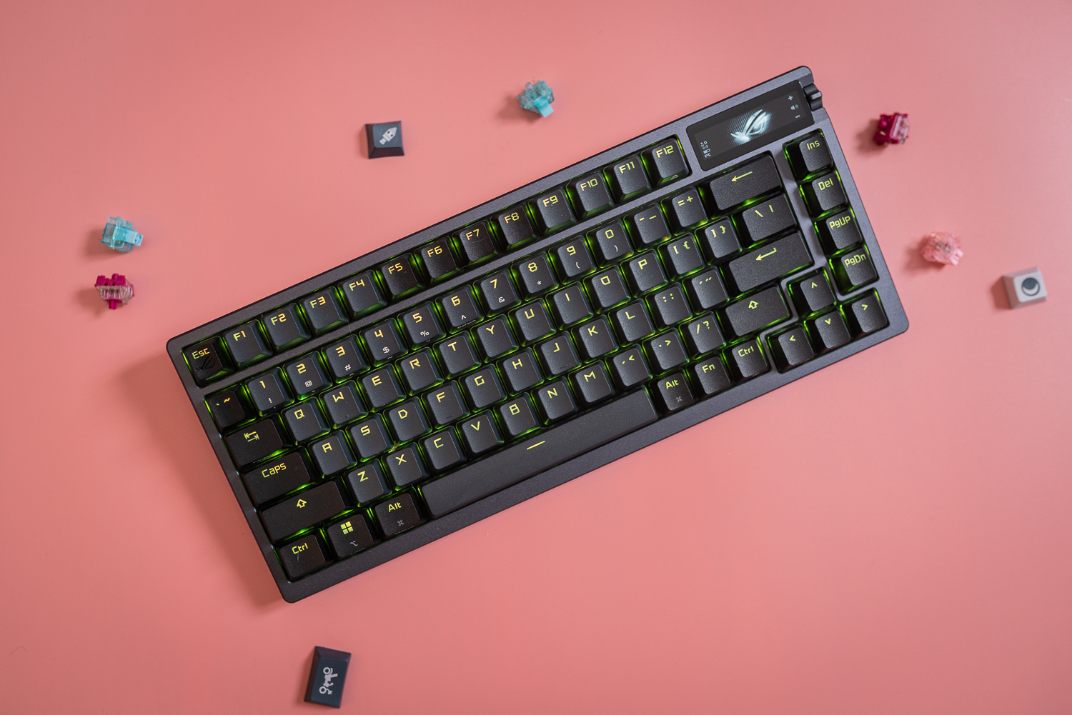 The Asus ROG Azoth keyboard sitting among key switches and key caps.
