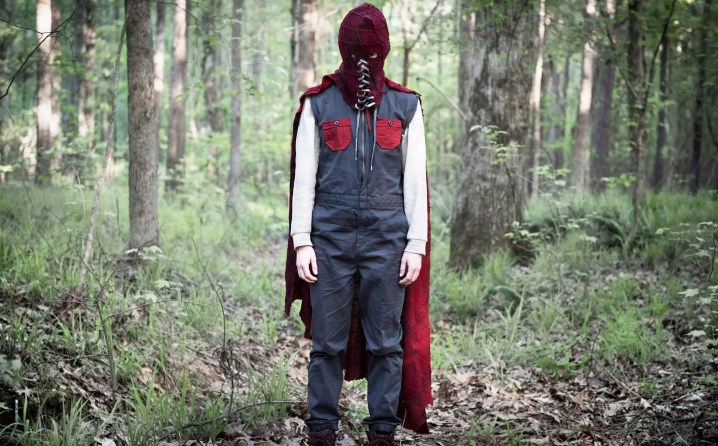 A child stands in a forest in Brightburn.