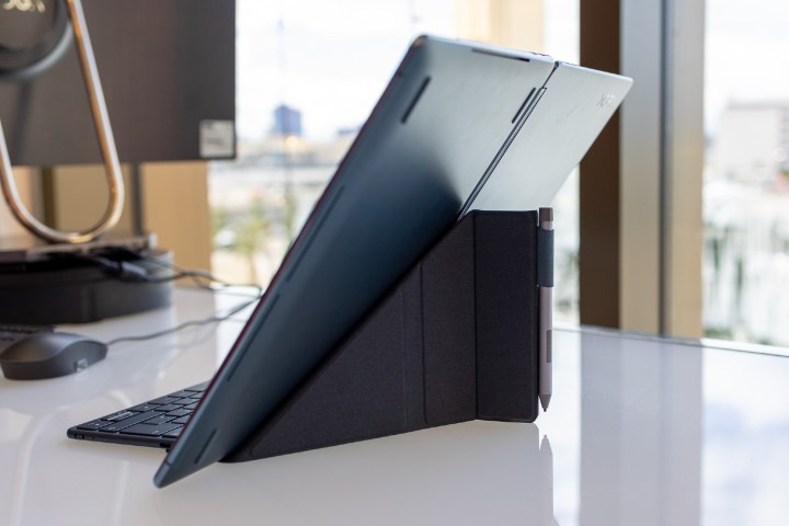 The Lenovo Yoga Book 9i Origami stands on the stand.