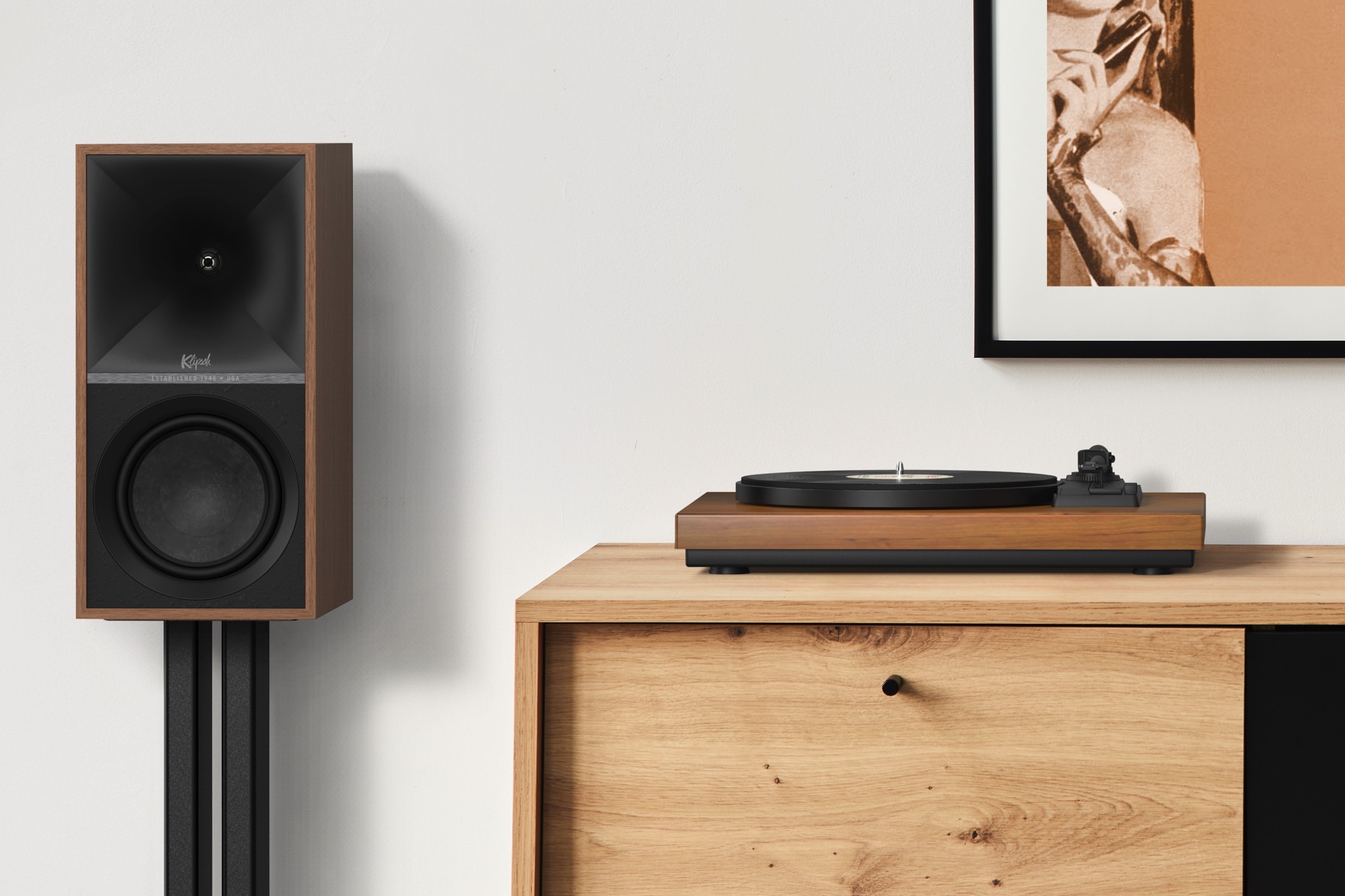 Klipsch The Sevens in walnut finish next to a turntable.