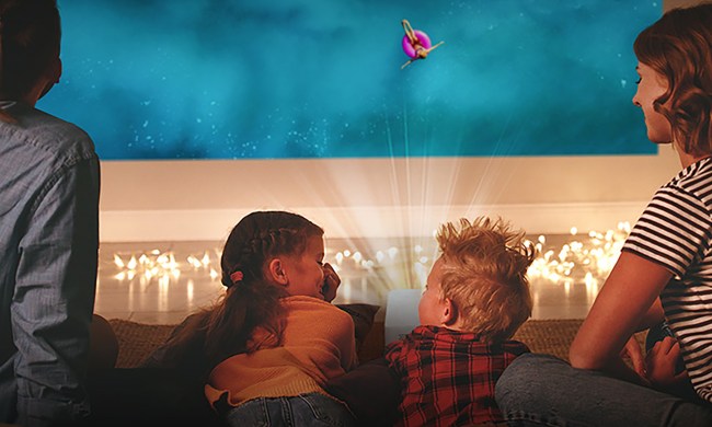 A family watching the LG CineBeam Portable Projector.