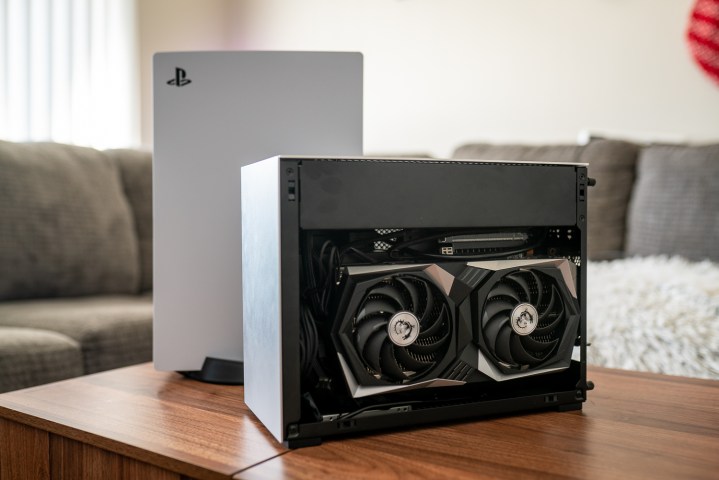 A mini PC sitting in front of the PS5.