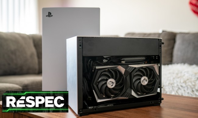 A PC sitting next to a PS5 on a coffee table.