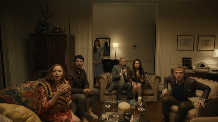The family from Servant looking shocked at the TV screen.