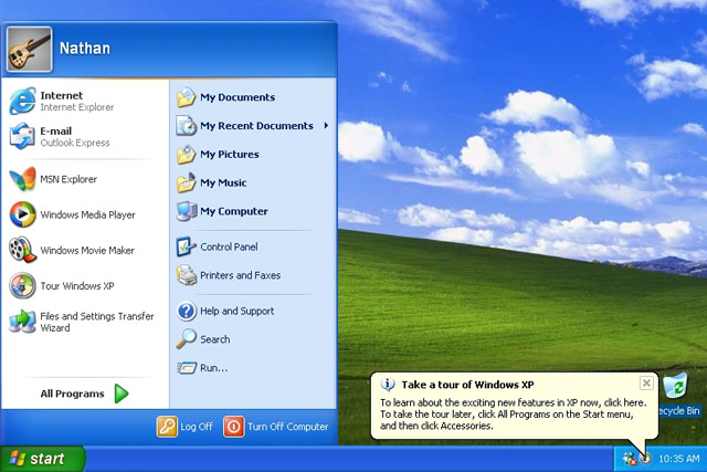 Windows XP home screen with Start menu open.