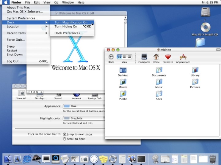 An deasc i gcóras oibriúcháin Apple OS X 10.0 Cheetah Mac, le tromchúiseach fuinneoga ar oscailt.