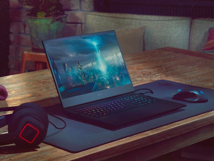 HP Omen 16-inch gaming laptop on desk with gameplay action on screen.
