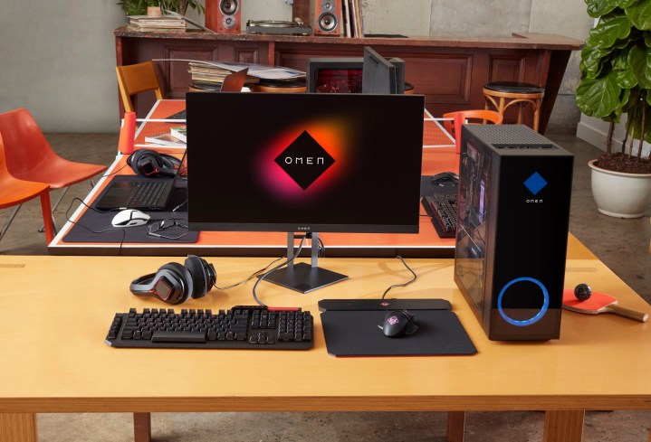 An HP Omen 25L setup on a desk with external gaming monitor.