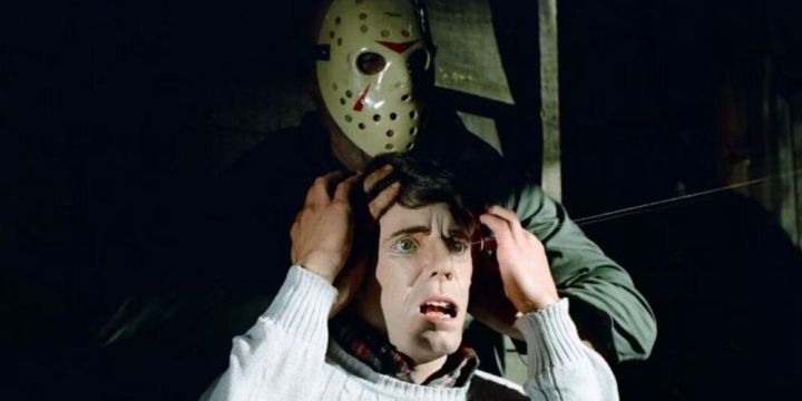 Jason crushes the head of a victim while wearing his iconic hockey mask.