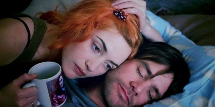 Jim Carrey and Kate Winslet cuddle in bed in Eternal Sunshine of the Spotless Mind.