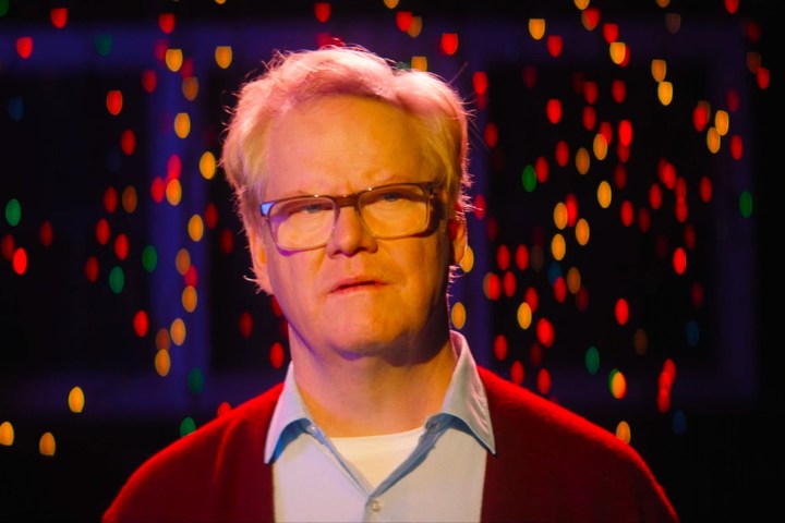 Jim Gaffigan stands surrounded by colorful lights in Linoleum.