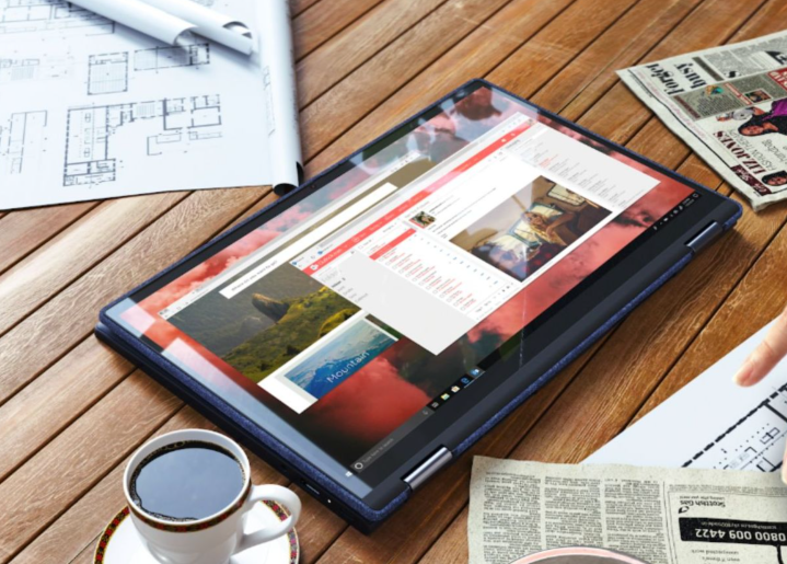 A Lenovo Yoga 6 resting on a table in tablet mode.