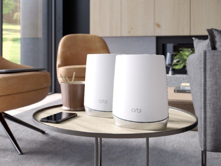 The Netgear Orbi AX4200 Tri-Band Mesh Wi-Fi 6 System (2-pack) on a table.