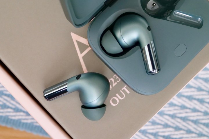 The OnePlus Buds Pro 2 earbuds in and out of the case.