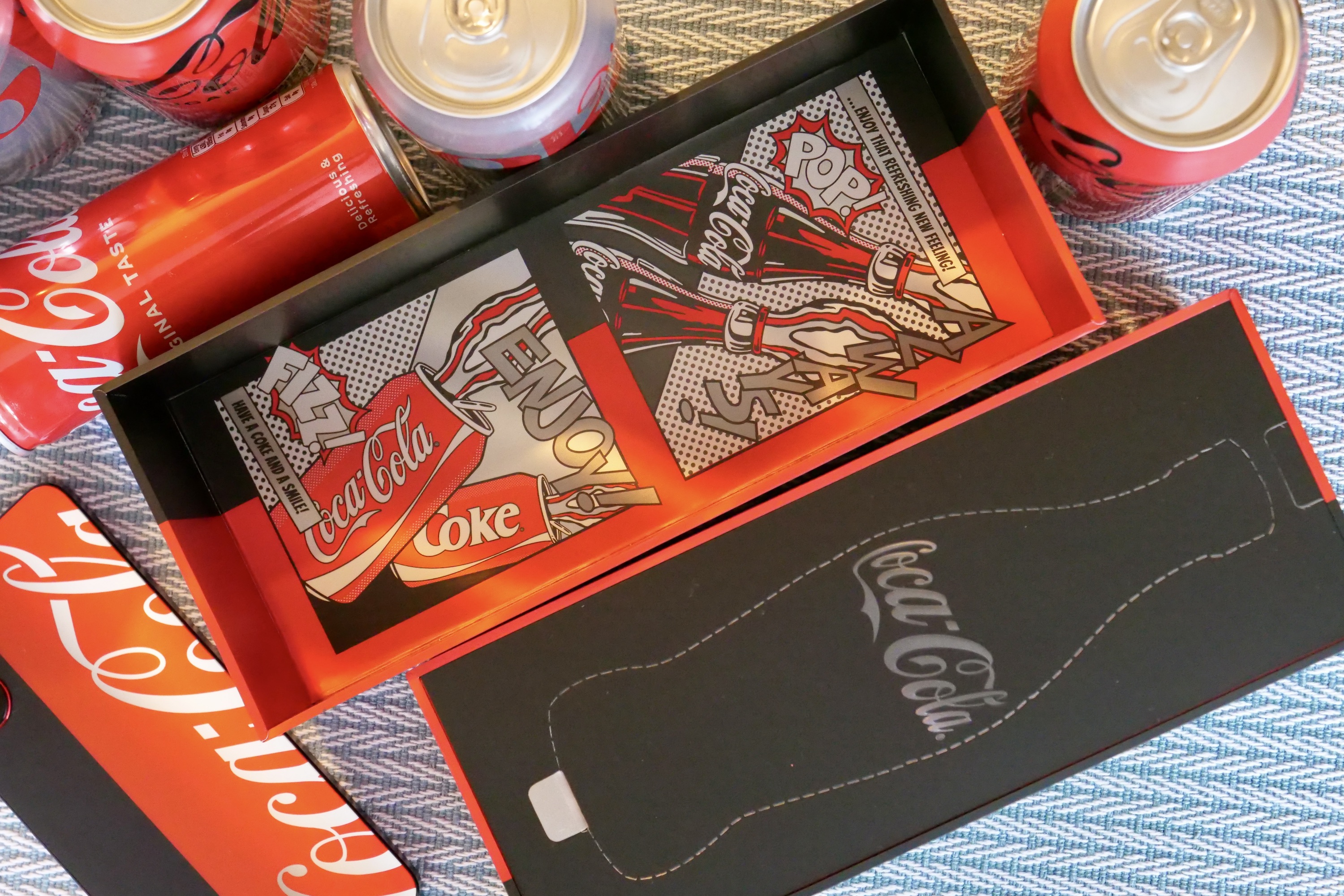 The inside of the themed box containing the Realme X Coca-Cola phone.