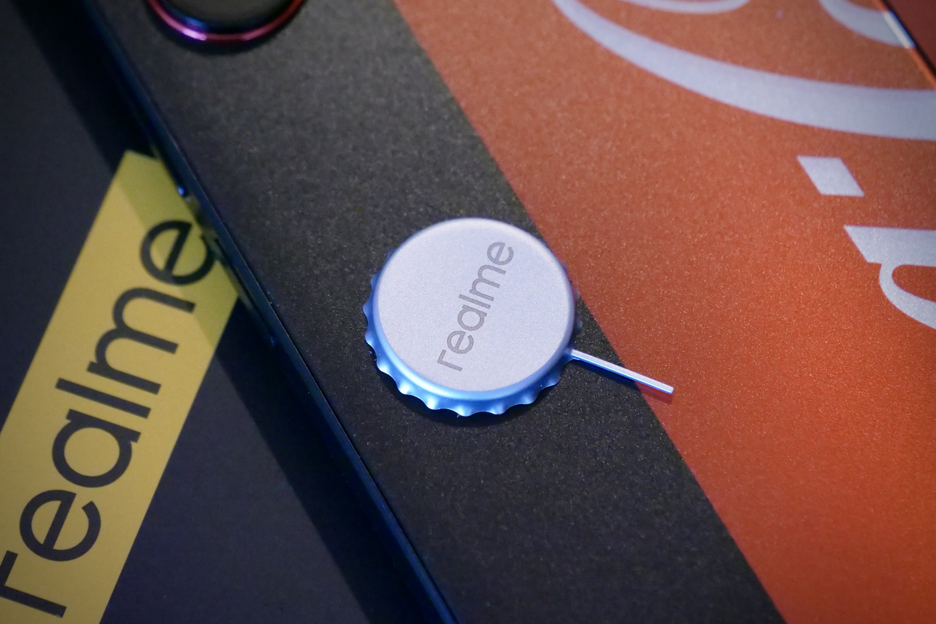 The Realme X Coca-Cola phone's SIM tray removal tool.