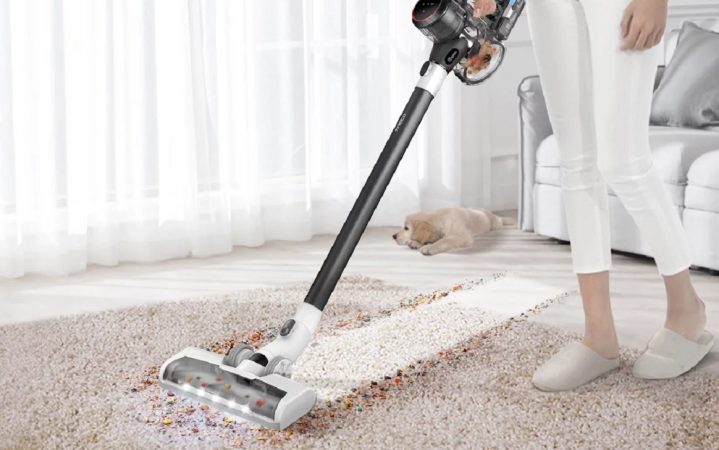Cleaning the carpet using the Tineco Pure One S11 Spartan cordless vacuum.