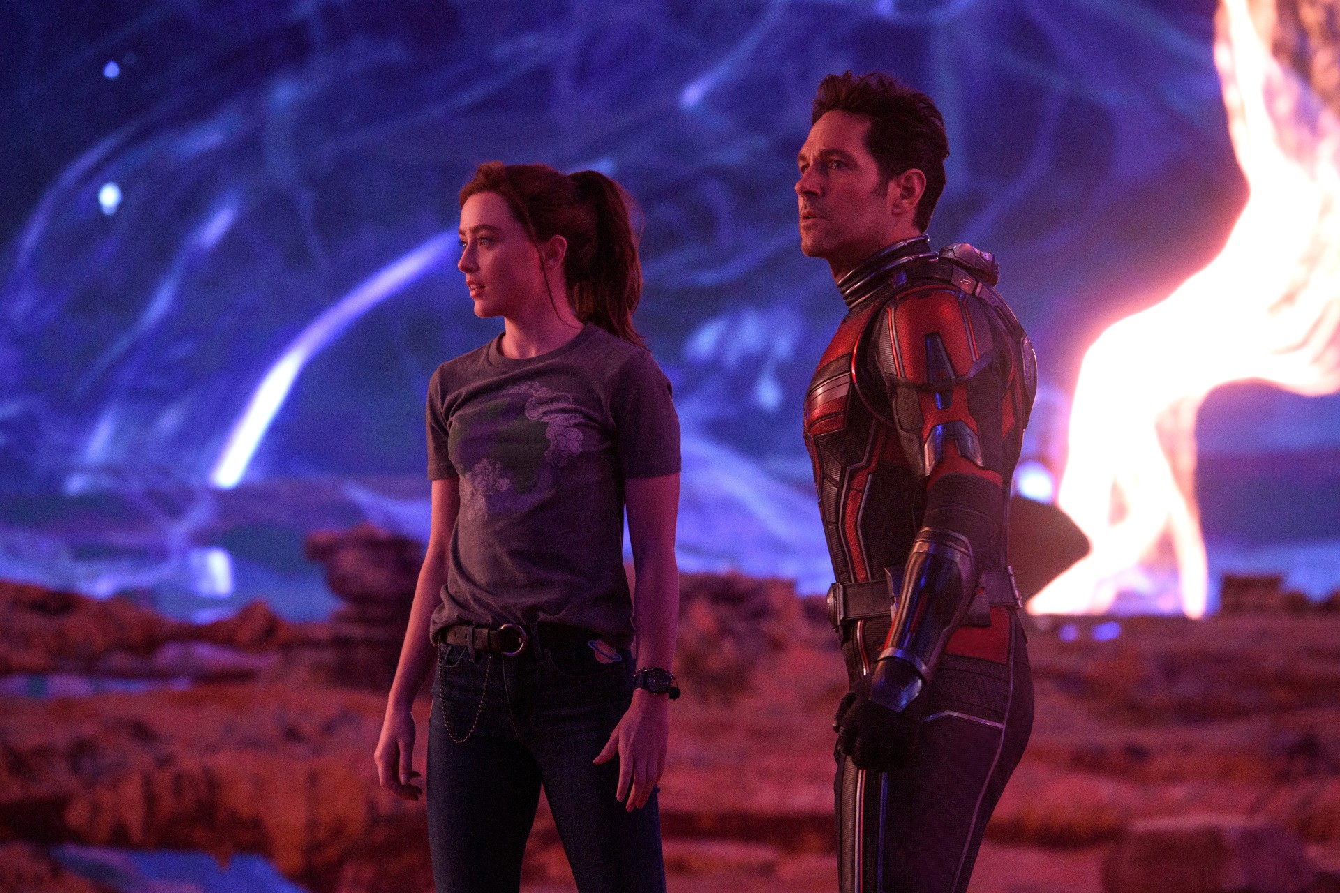 Kathryn Newton and Paul Rudd stand on the surface of a weird planet in a scene from Ant-Man and the Wasp: Quantumania.