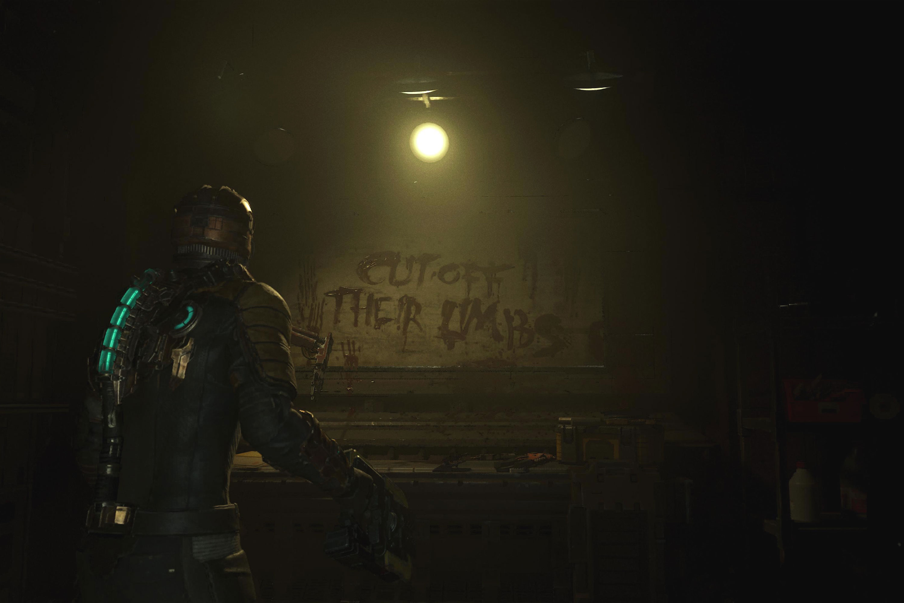 Uma captura de tela do remake de Dead Space que mostra Isaac olhando para uma escrita na parede que diz 