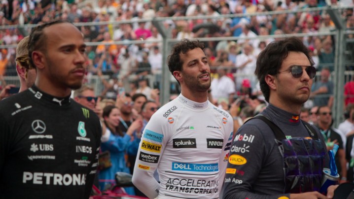 Drivers Lewis Hamilton, Daniel Riccardo and Sergio Perez stand together before a race in a scene from Season 5 of Formula 1: Drive to Survive.