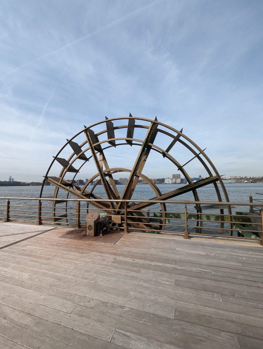 Wide-angle photo from the Pixel 7 Pro, showing a large wheel by a dock.