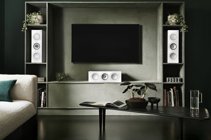 MBARGOED till Feb. 7, 2023. -- The KEF R2 Meta center speakers in a left-center-right configuration with a TV.