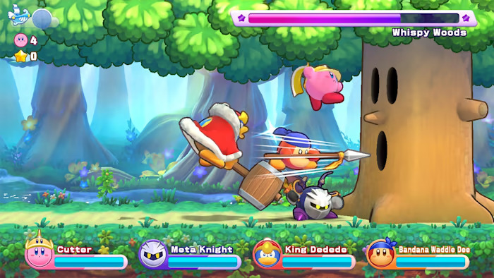 Kirby e i suoi amici combattono Whispy Woods in Kirby's Return to Dream Land Deluxe.