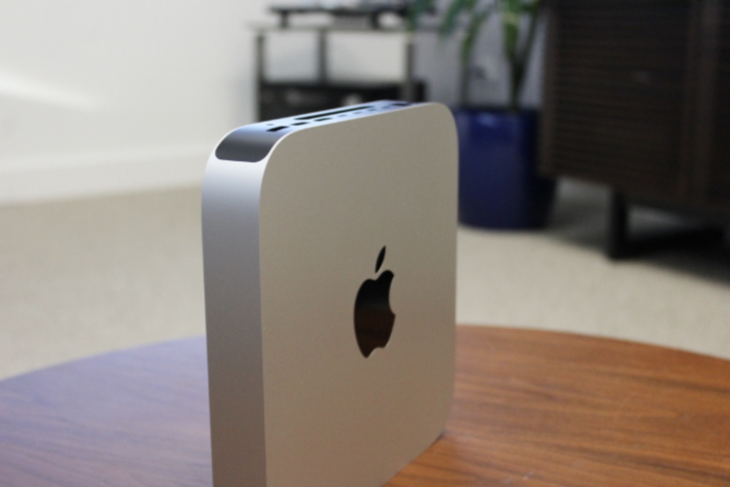 Mac mini standing up on its side.