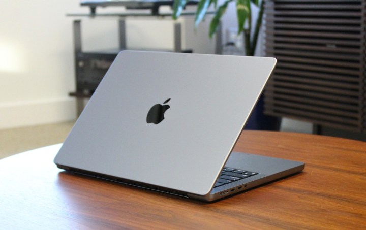 The MacBook Pro on a board table.