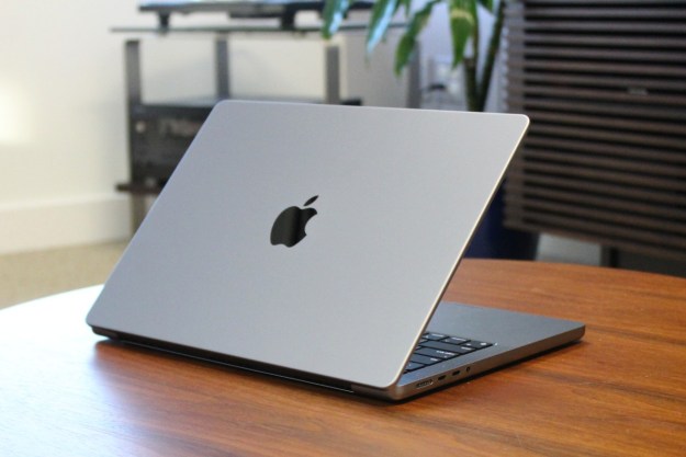 The MacBook Pro on a wooden table.