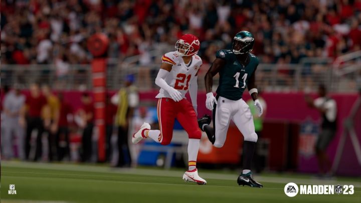 A Chiefs and Eagles player run down the field in Madden NFL 23.