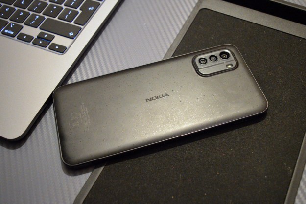 The Nokia G60 5G laid face down on a lapdesk.