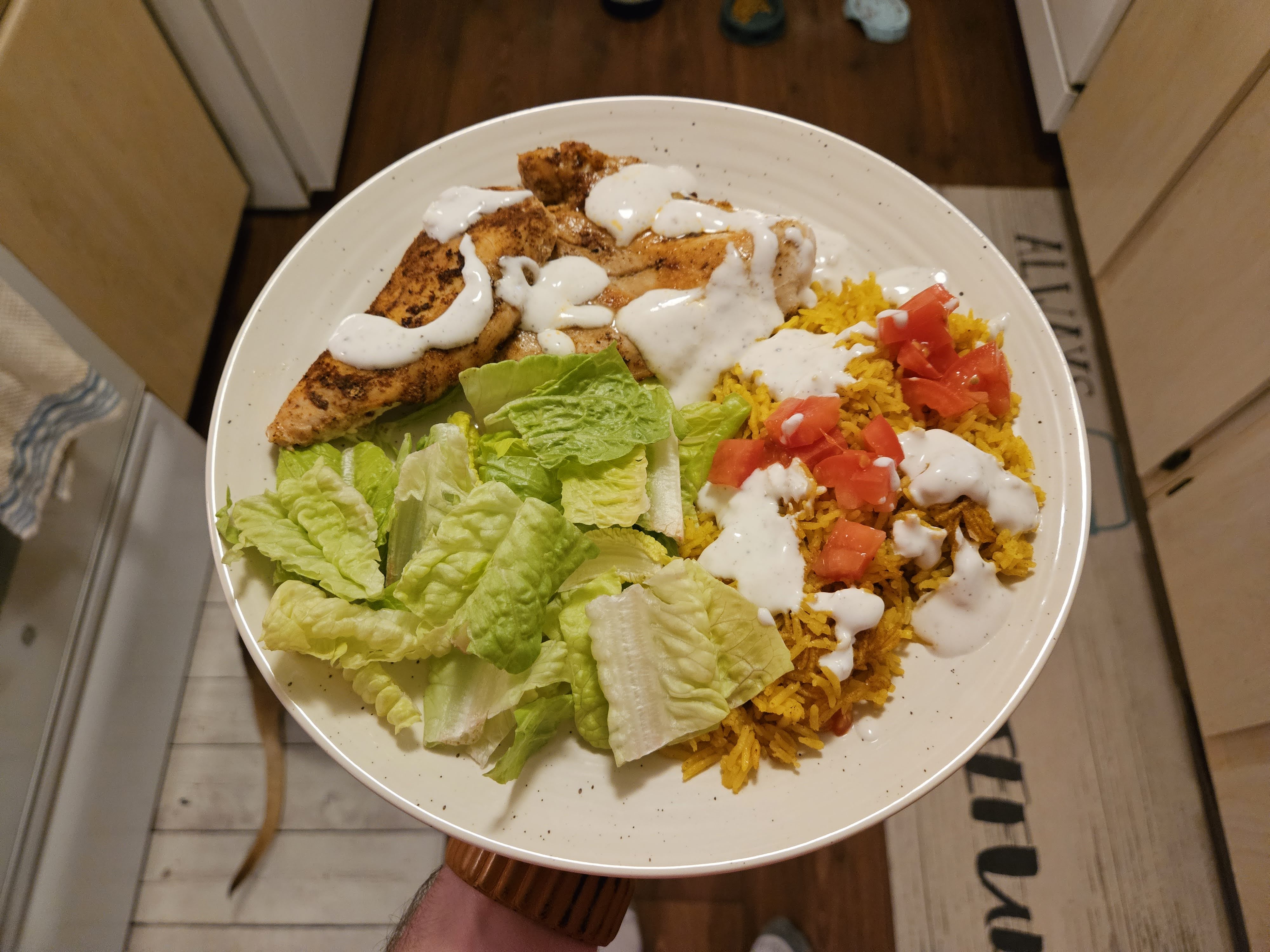 Samsung Galaxy S23 Plus photo of chicken, salad, and rice on a plate.
