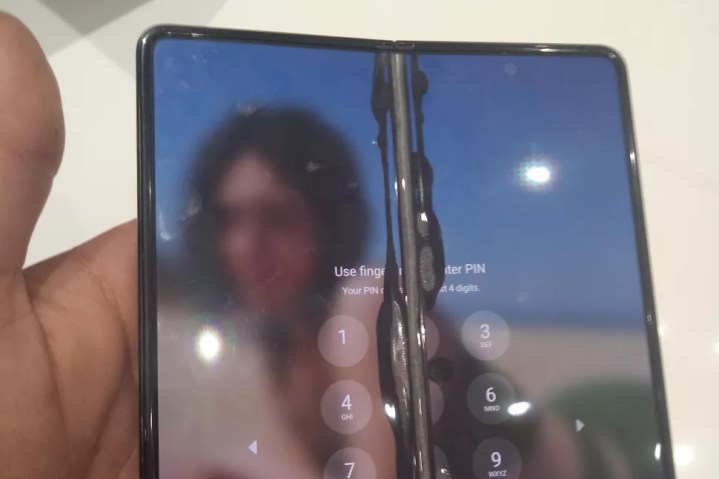 A Samsung Galaxy Z Fold 3 with a broken screen.