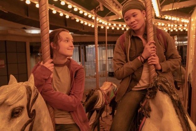 Two girls ride a merry-go-round in The Last of Us.